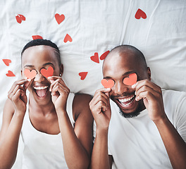 Image showing Heart, bedroom and overhead with a valentines day black couple lying on a bed in their home together. Love, face or emoji with a romantic man and woman dating in their house to relax from above