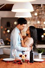 Image showing Love, smile and romance, couple hug on valentines day date at home with wine, rose petals and bokeh. Date night, man and woman in living room, valentine celebration and happy relationship together.