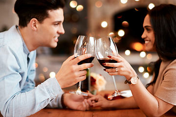 Image showing Couple holding hands at table, love and cheers with wine on valentines day date at home with smile and bokeh. Date night, man and woman in living room, valentine celebration and happy relationship.