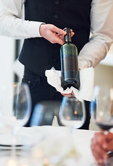 Image showing Waiter hands, wine and restaurant table with white towel, luxury hospitality and vintage for fine dining. Man, bottle service and holding drink for customer decision at celebration on valentines day