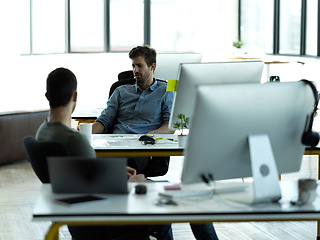 Image showing Businessman, startup partnership and friends talk at desk with discussion, advice and conversation at workplace. Entrepreneur group, teamwork and chat in office for idea, planning and company goals