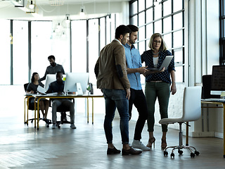 Image showing Business people, laptop and conversation in modern office, planning and brainstorming for new project. Teamwork, staff and group with device, discussion and share ideas for website launch and email