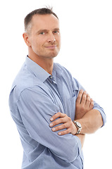 Image showing Confidence, pride and portrait of a man in a studio posing with crossed arms for leadership. Happy, smile and face of a confident mature male model with positive mindset isolated by white background.