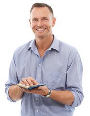 Image showing Portrait, man and notebook for business ideas, smile and guy isolated on white studio background. Face, male entrepreneur and gentleman with happiness, reading and focus for new project on backdrop