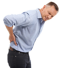 Image showing Injury, business man and back pain in studio isolated on a white background. Burnout, fatigue stress and injured mature male entrepreneur with fibromyalgia, arthritis or painful spine after accident.