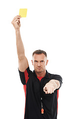 Image showing Portrait, foul and yellow card with a soccer referee in studio isolated on a white background for rules. Football, call and warning with a male ref giving a booking during a competitive sports match