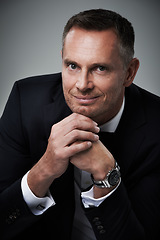 Image showing Portrait, man and in suit with smile, leadership and confident guy on grey studio background. Face, male leader and entrepreneur with elegance, glamour and management with happiness or corporate deal