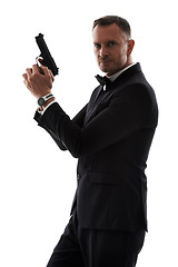 Image showing Secret agent man with gun isolated on a white background for law, action movie or security of a criminal businessman. Private detective, professional person crime or actor firearm in studio portrait