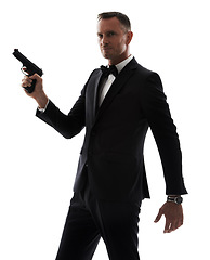 Image showing Professional man with gun isolated on a white background for secret service agent, security or criminal businessman. Investigation detective person, boss or crime actor in suit with firearm in studio