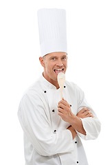 Image showing Portrait of chef licking wooden spoon, goofy cafe owner and small business in restaurant industry isolated on white background. Happy, discount deal and delicious menu special or promotion in studio.