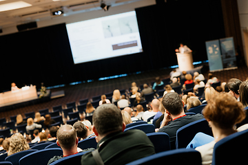 Image showing Speaker giving a talk on scientific conference. Audience at the conference hall. Business and Entrepreneurship concept.