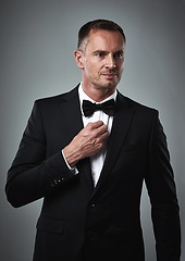 Image showing Fashion, mature man in tuxedo and handsome face, online dating profile isolated on grey background in studio. Luxury, success and rich, elegant celebrity or actor style with date for valentines day.