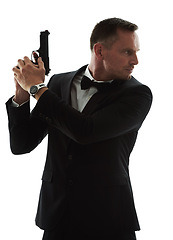 Image showing Movie star, gun and spy agent man with isolated, white background and mockup ready for action. Actor, weapon and tuxedo suit of a man looking mysterious with classy style and pistol for danger