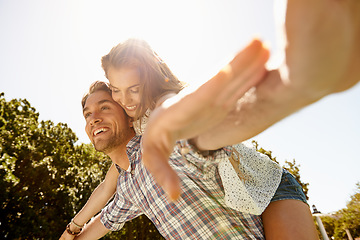 Image showing Happy couple, piggy back or airplane in nature park, garden or low angle bonding on valentines day, relax date or romance love. Smile, man or carrying woman in aeroplane, fun game or freedom activity