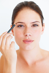 Image showing Beauty, makeup and portrait of woman with eyebrow pencil in studio for shape or grooming on white background. Face, brow and girl model with microblading tool for drawing, filling or product isolated