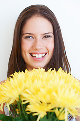 Image showing Happy, flowers and smile with portrait of woman for spring, beauty and celebration gift. Present, summer and blossom with face of girl and bouquet isolated on white background for plant and season