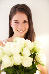 Image showing Portrait, woman and white roses with beauty, smile and achievement for romance, happiness and excited. Face, man and woman with flower bouquet, celebration or floral gift for joy or romantic gesture