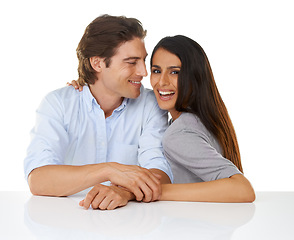 Image showing Portrait, love and couple smile together in studio with white background and hand holding. Sitting, studio and face of a young man and woman from Israel in marriage with casual fashion and connection