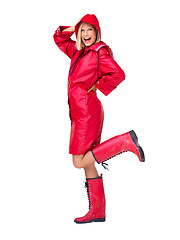 Image showing Winter, red raincoat and portrait of woman on white background with smile, content and happy mindset. Fashion, weather and isolated full body of girl in style, trendy and creative clothes in studio