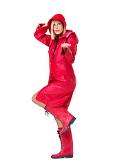 Image showing Winter, waterproof and portrait of a woman with a raincoat isolated on a white background in studio. Insurance, happy and model with clothes for rain, boots and prepared for bad weather on a backdrop