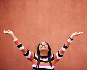 Image showing Black woman, hands up and wall background with space for mockup with smile, happy and excited in city. Young gen z girl, outdoor and happiness with mock up, fashion and palm with product placement