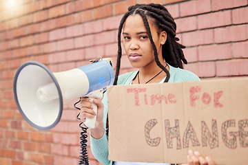 Image showing Portrait, poster and woman on megaphone for change, protest or human rights on brick wall background. Billboard, speaker and face of girl for announcement of global, transformation or freedom mission