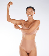 Image showing Health, muscle flex and portrait of black woman on white background with smile, body wellness and beauty. Fitness, exercise and girl excited for weight loss, healthy lifestyle and progress in studio