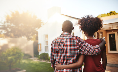 Image showing Back view, black couple and hug outdoor at house, real estate and new loan for luxury home. Man, woman and people in front of property investment, moving and dream neighborhood for building mortgage