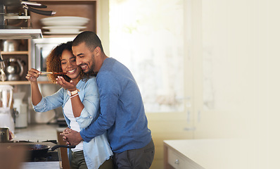 Image showing Cooking, black couple and hug in a kitchen with marriage and love at home with mockup. Dinner, food taste and happy woman and man together with care in a house with mock up and happiness from eating