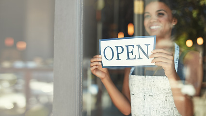 Image showing Small business, open sign and woman in cafe window for welcome, advertising and coffee shop promotion. Manager startup owner and excited and happy entrepreneur with opening poster for restaurant