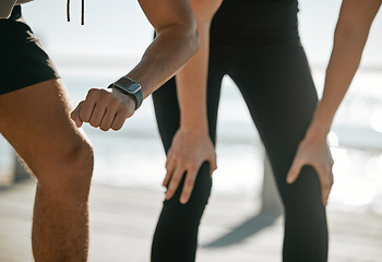 Image showing Running couple, time and smartwatch with fitness and check heart rate with cardio and outdoor workout. Legs, hands and cardiology with runner black man and woman, exercise and wellness with run break