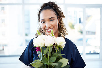 Image showing Happy, portrait and woman nurse with flowers for valentines day, romance or anniversary in the hospital. Happiness, smile and female healthcare worker with a floral bouquet of roses in the clinic.