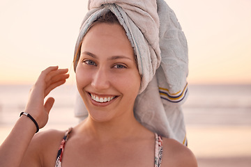 Image showing Woman, portrait and towel on head at beach, summer vacation or tropical holiday in Australia. Face, happy female and relax at ocean with wet hair cloth, smile or freedom of happiness at travel resort