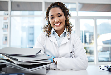 Image showing Doctor, documents and portrait of healthcare professional with paperwork on desk or table in the office smile and happy. Medical, research and medicine student studying and learning for knowledge