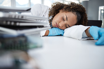 Image showing Science, exhausted and scientist taking nap in lab after working on innovation experiment, test or research. Tired, burnout and professional female scientific employee sleeping on desk in laboratory.