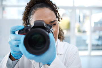 Image showing Camera, medical and forensics with black woman in laboratory for investigation, crime scene and photography evidence. Research, analytics and observation with girl and digital pictures for science