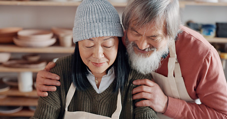 Image showing Senior couple, hug and pottery studio work for clay sculpture, product manufacturing and mud design. Asian man, creative woman or retirement elderly in small business, workshop or Japanese art studio