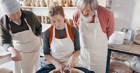 Image showing Pottery, group and teacher mold clay in studio or workshop learning with instructor woman, coach or trainer. Lesson, art and people practice hobby, arts or crafting handmade ceramic mug, cup or bowl