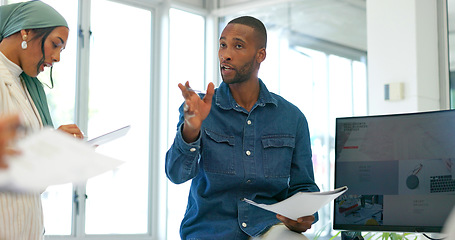 Image showing Black businessman, mentor or diversity meeting on paper, documents or review in coaching or training feedback. Speaker, leadership or talking in workshop, collaboration or teamwork strategy planning