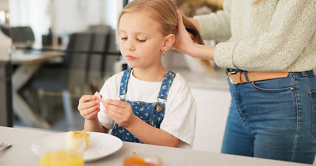 Image showing Hair care, brush and kid with mother talking, play and relax in home kitchen during morning breakfast. Mom prepare for day, bonding time and child care for happy family youth girl with mamas love