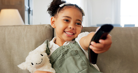 Image showing Relax, toy and girl watch television with remote for chill leisure time alone in home on sofa. Tv program, streaming and subscription decision and choice with cartoon for entertainment on home sofa