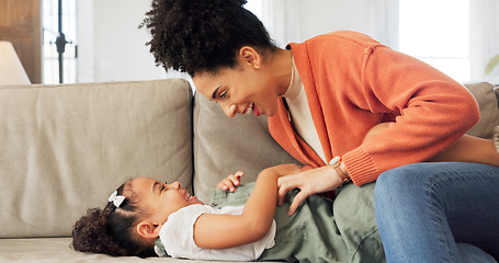 Image showing Happy, mother and child with hug, kiss and love for playful relationship bonding on living room sofa at home. Mama and kid playing together in happiness for loving care or joy relaxing on the couch