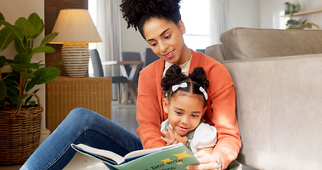 Image showing Mother, child and reading education, learning and teaching with story book for kids in the home living room. Latino woman and child read book, literature or story while relax, smile or happy together