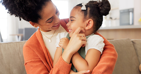 Image showing Happy, mother and child with hug, kiss and love for playful relationship bonding on living room sofa at home. Mama and kid playing together in happiness for loving care or joy relaxing on the couch