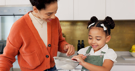 Image showing Mother, child and learning for baking with flour helping in the kitchen with recipe or ingredients at home. Happy mom teaching helpful kid to bake or mix together with smile for family bonding time