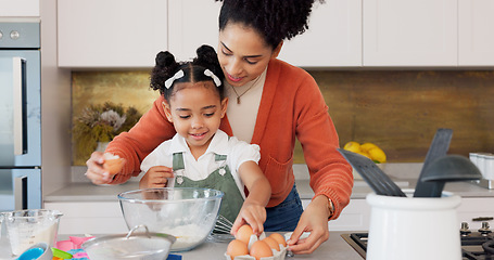 Image showing Mother, child and baking with eggs in the kitchen for family bonding, learning and fun with ingredients at home. Happy mom teaching helpful kid to bake, cook or mix for recipe together at the house