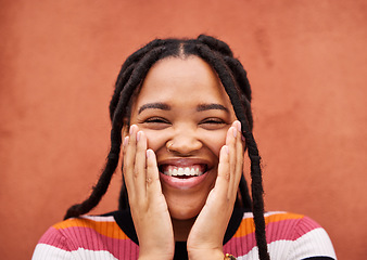 Image showing Happy, laughter and portrait with a black woman on an orange background outdoor for joy or humor. Funny, laugh and smile with an african american person laughing or joking against a color wall