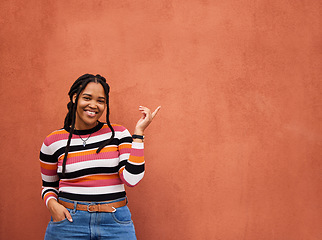 Image showing Mockup, portrait or black woman with marketing, logo or branding space on orange wall background. Product placement or happy African girl advertising discount, sales offer or promotion announcement