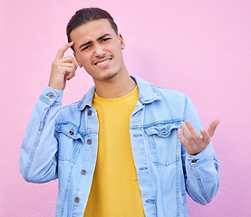 Image showing Confused, question and portrait of a man thinking isolated on a pink background in studio. Doubt, idea and face of a person with a solution, difficult decision and thoughts of a choice on a backdrop