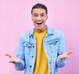 Image showing Man, portrait and wall with open hands, smile and excited wow for fashion, vision and success in city. Young gen z student, trendy clothes and surprise with happiness by pink background in metro